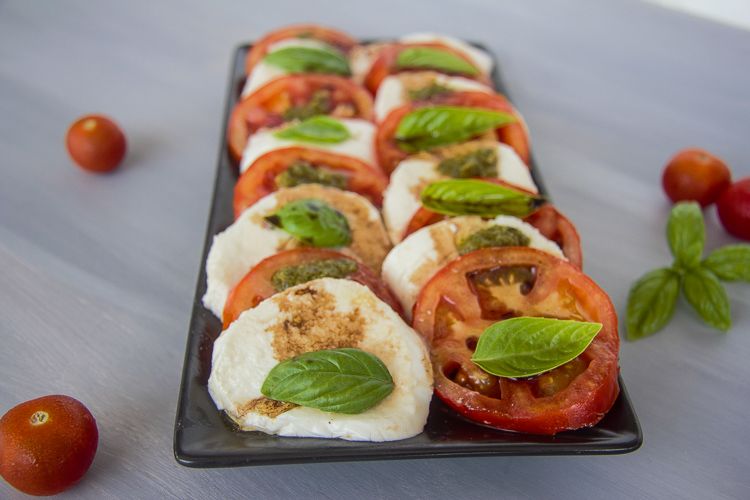 layers of tomatoes and mozzarella