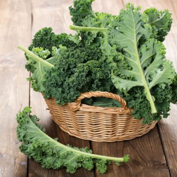 High protein kale in a basket on a wooden table.