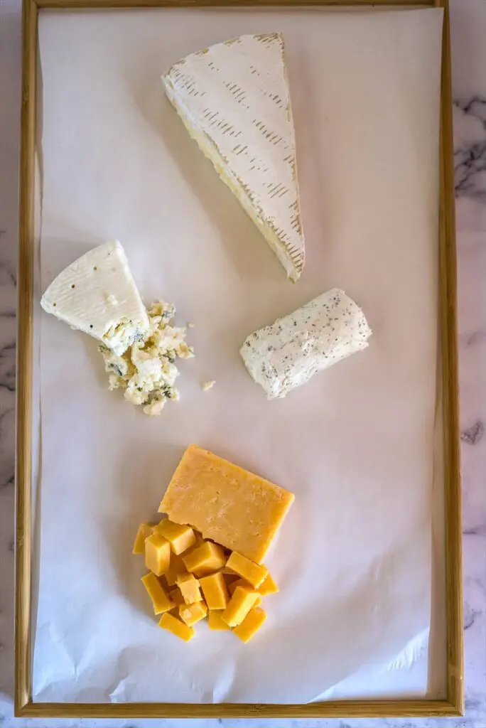 cheeses on a board