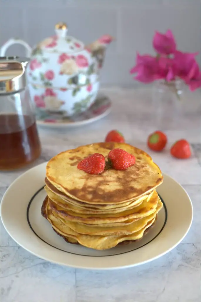 a stack of pancakes with berries