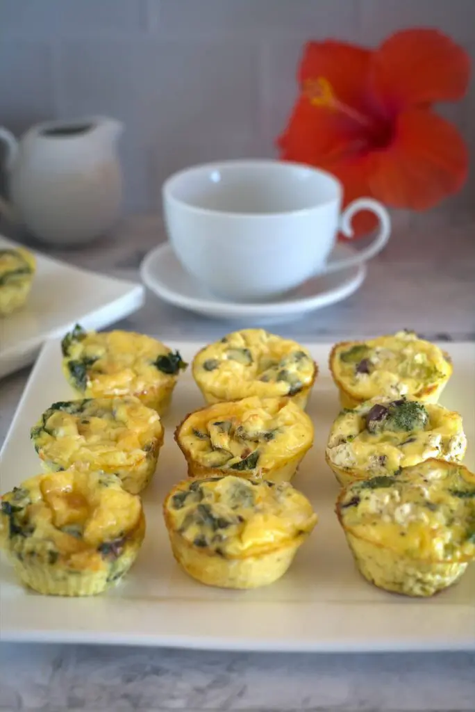egg muffins with 3 different fillings on a plate.
