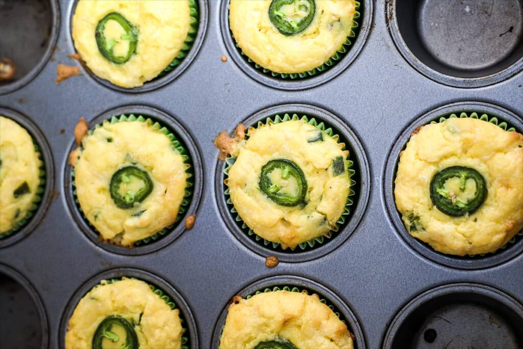 jalapeno cheese muffins in a tin.