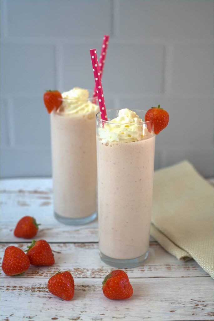 strawberry cheesecake smoothie in tall glasses