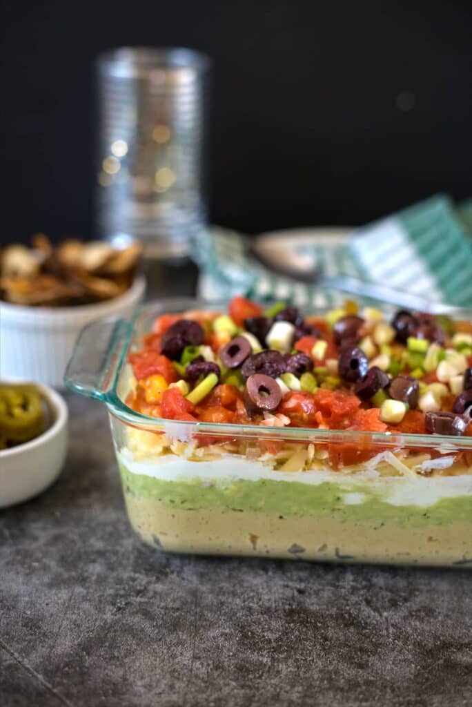 7 layer dip with salsa, low carb refried beans, guacamole, cheese, olives and onions