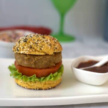 eggplant burger in bun on a plate