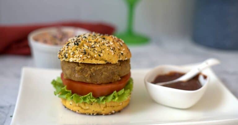 eggplant burger in bun on a plate