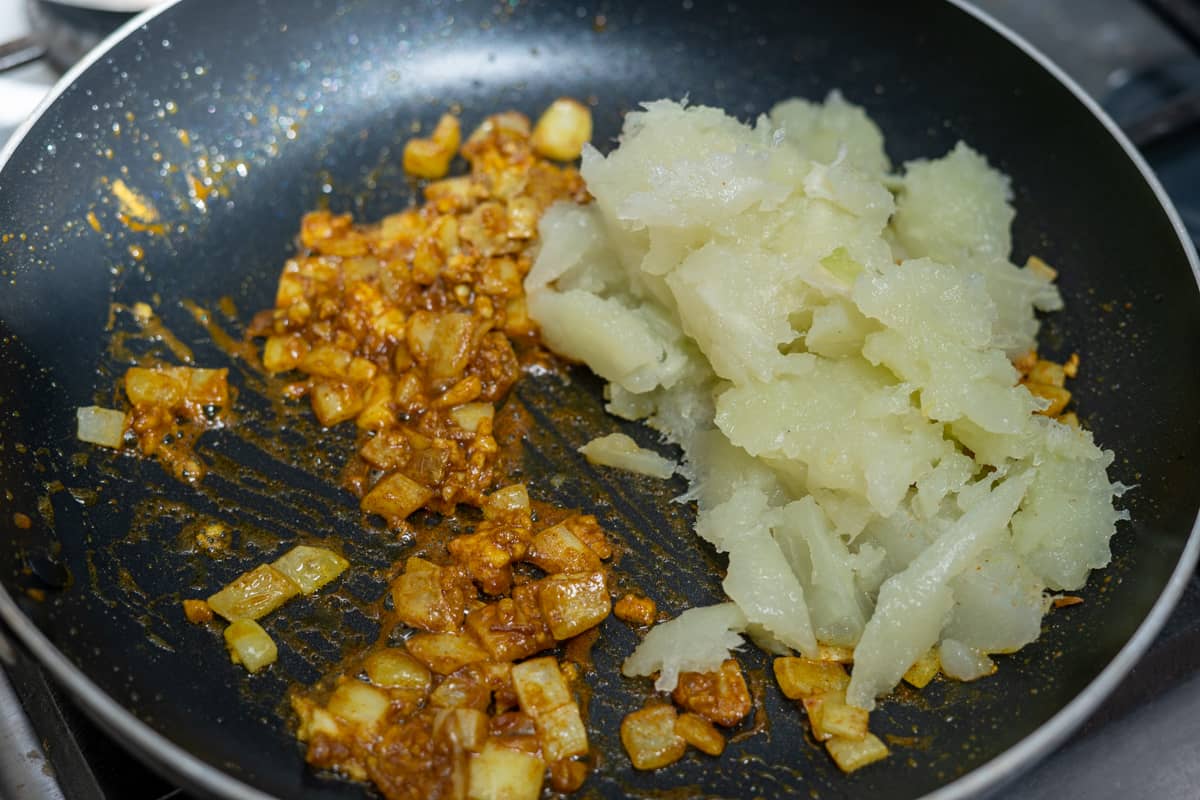 cooked chayote to the pan of spiced onion
