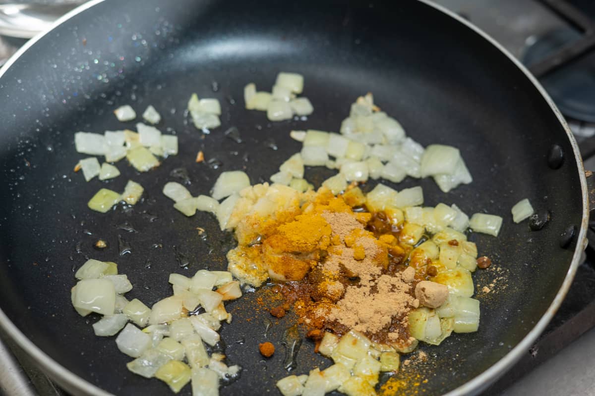 spices added to chopped onion