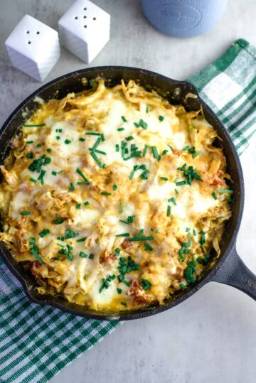 Overhead shot of cabbage and cheese baked in a skillet