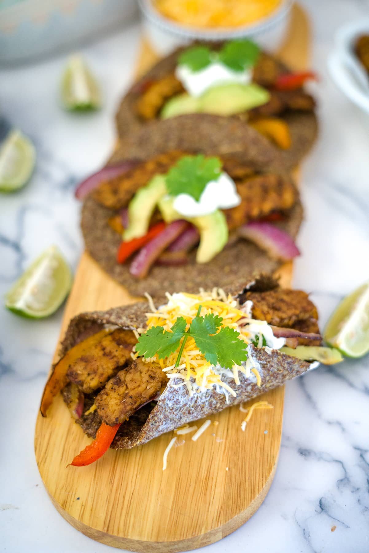 vegan tempeh fajitas on a board