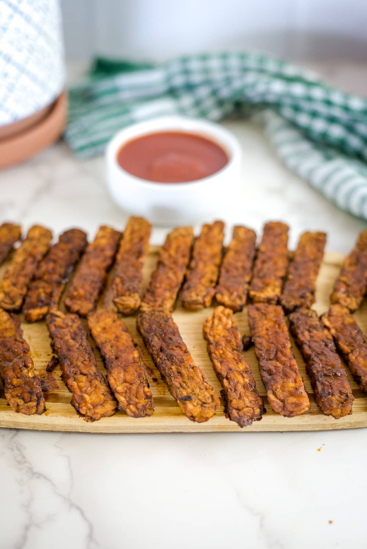 air fryer vegan bacon strips on a board