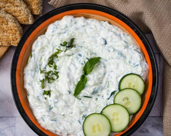 tzatziki sauce in a bowl with cucumber