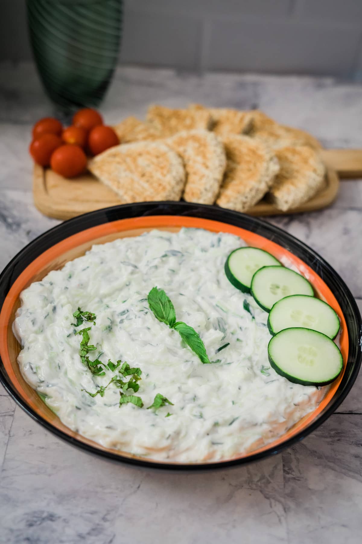 bowl of tzatziki with cucumber slices
