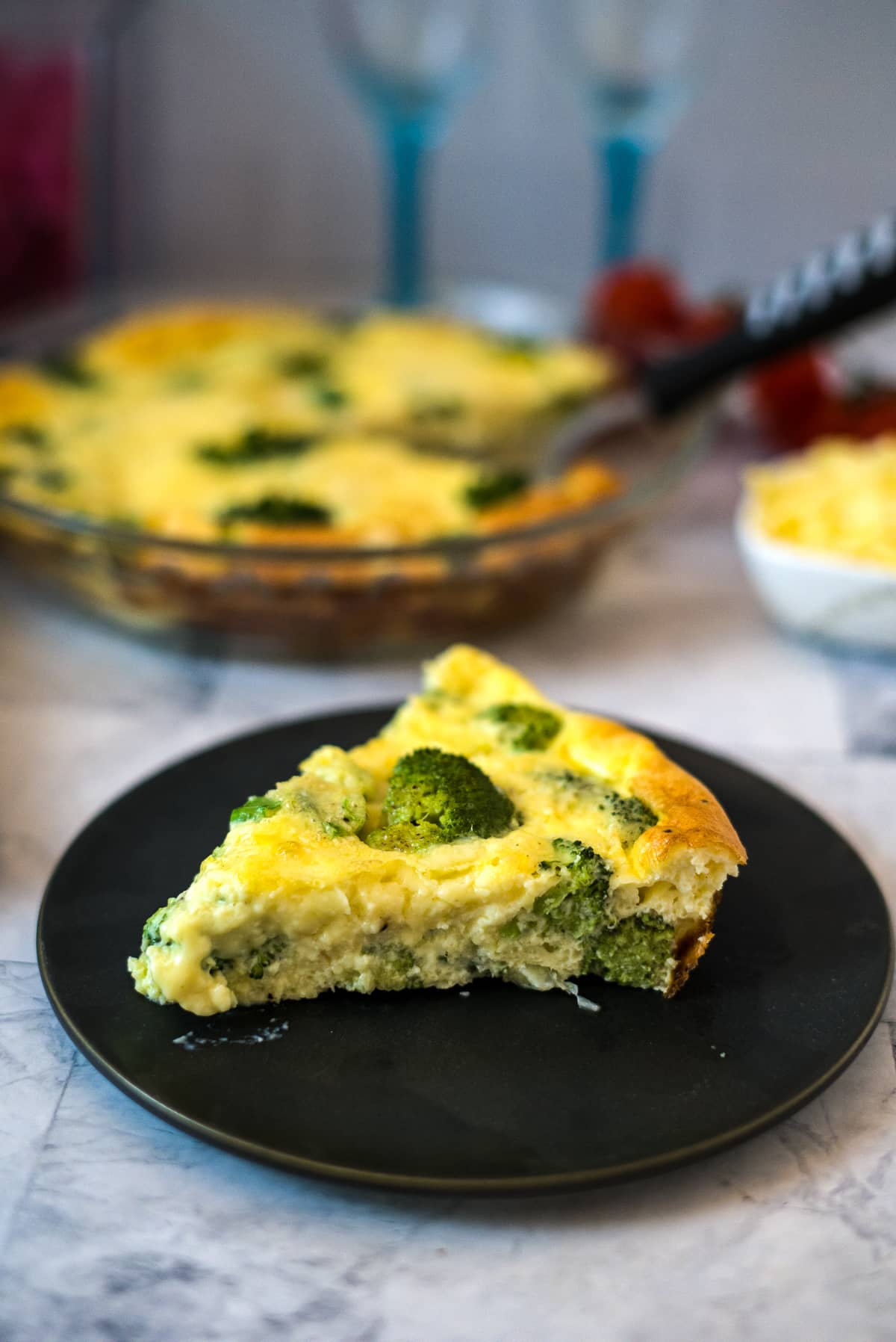 a slice of broccoli cheddar crustless quiche