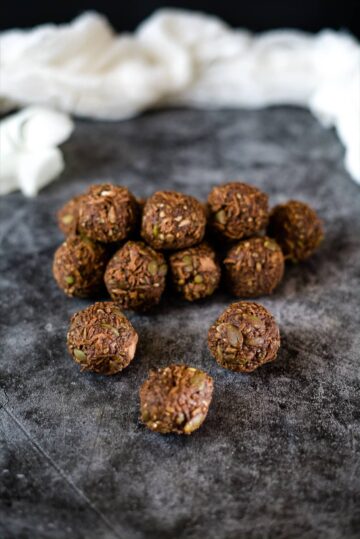 coconut balls with seeds and chocolate.