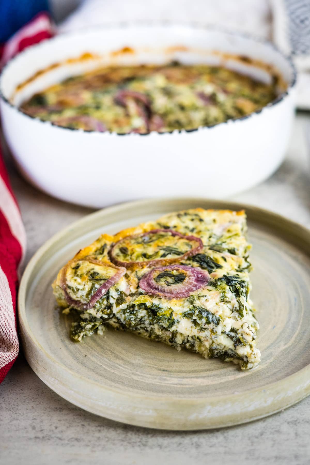 cottage cheese quiche slice on a plate.