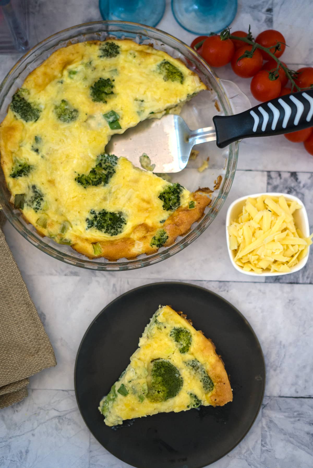 slice of broccoli cheddar crustless quiche on a plate
