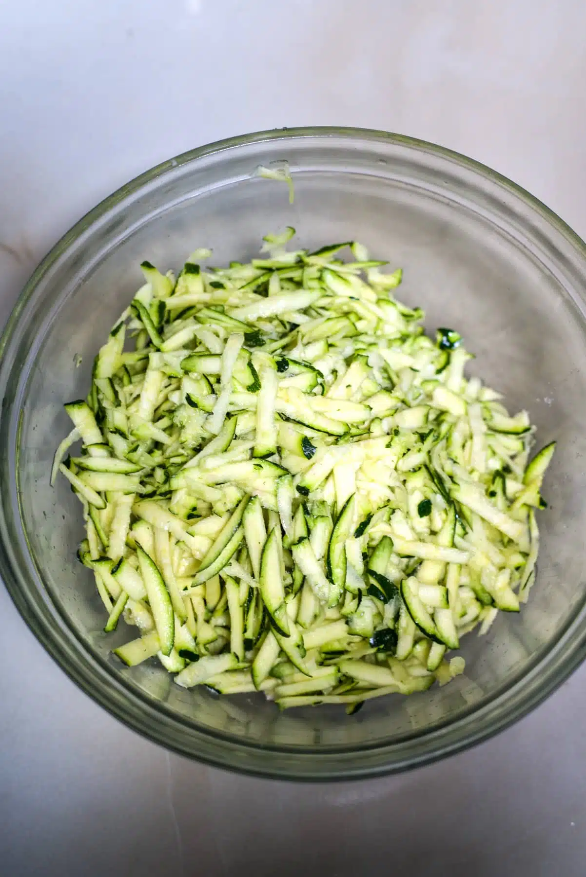 zucchini in a bowl with salt