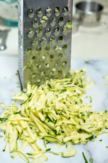 grated zucchini on a board