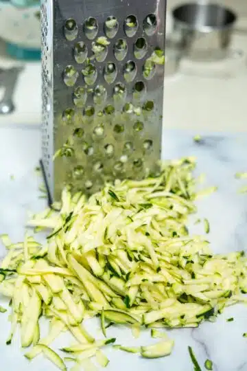 grated zucchini on a board