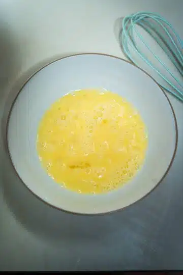 beaten egg in a bowl