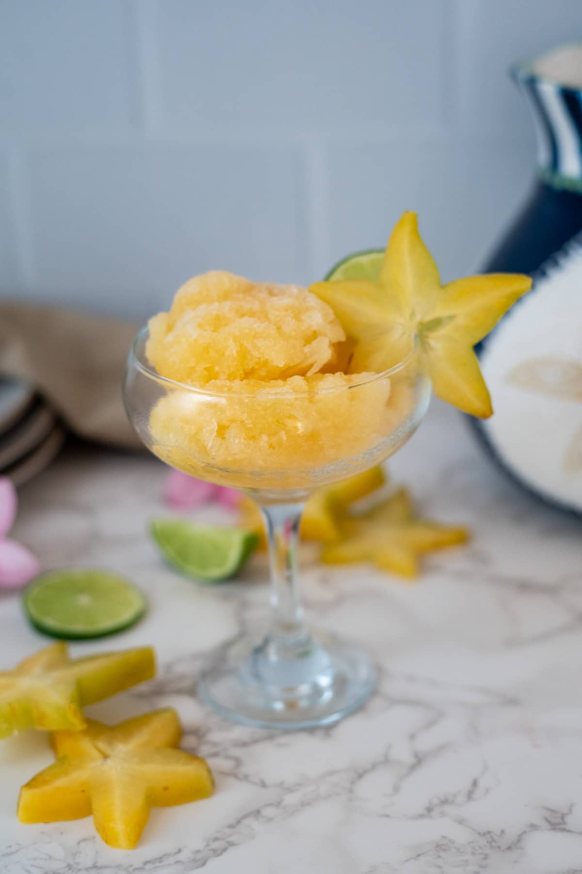 Star fruit sorbet served in a glass with star shaped garnishes.