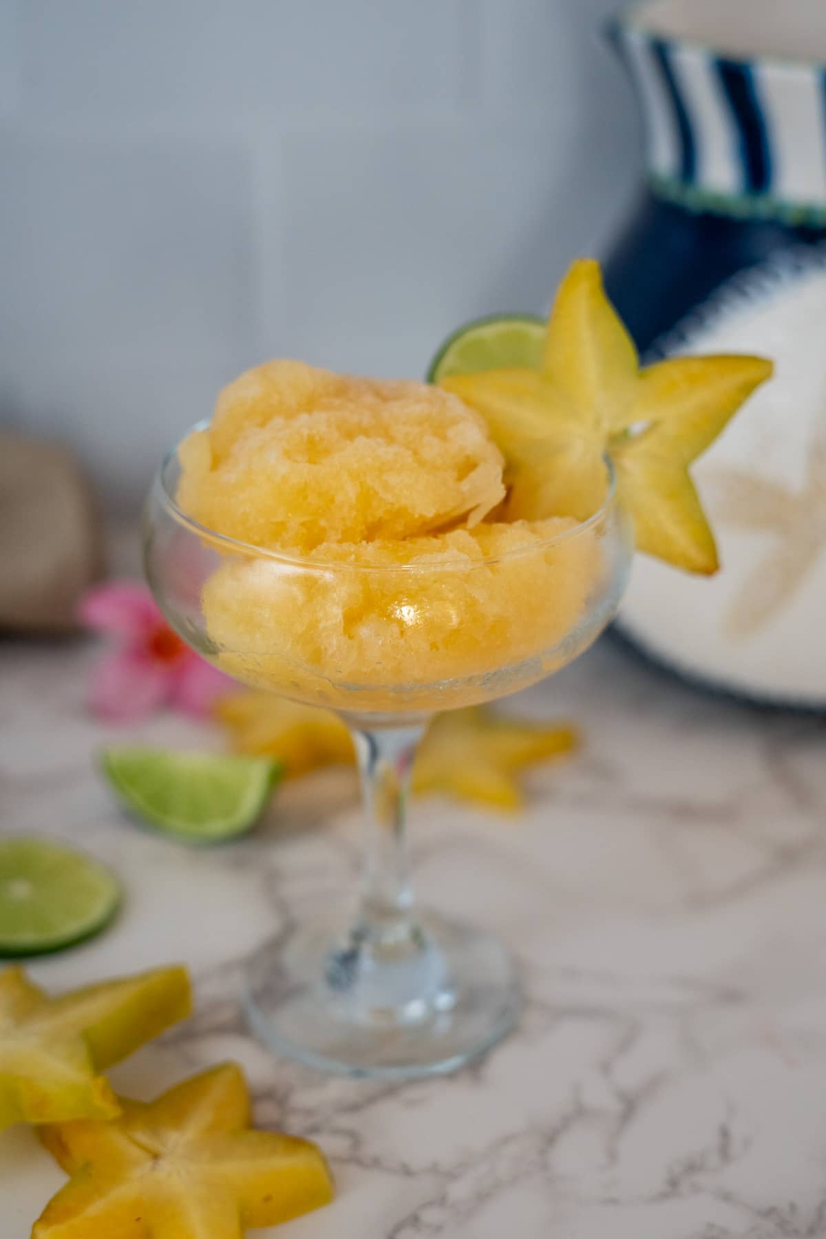 Star fruit sorbet in a glass.