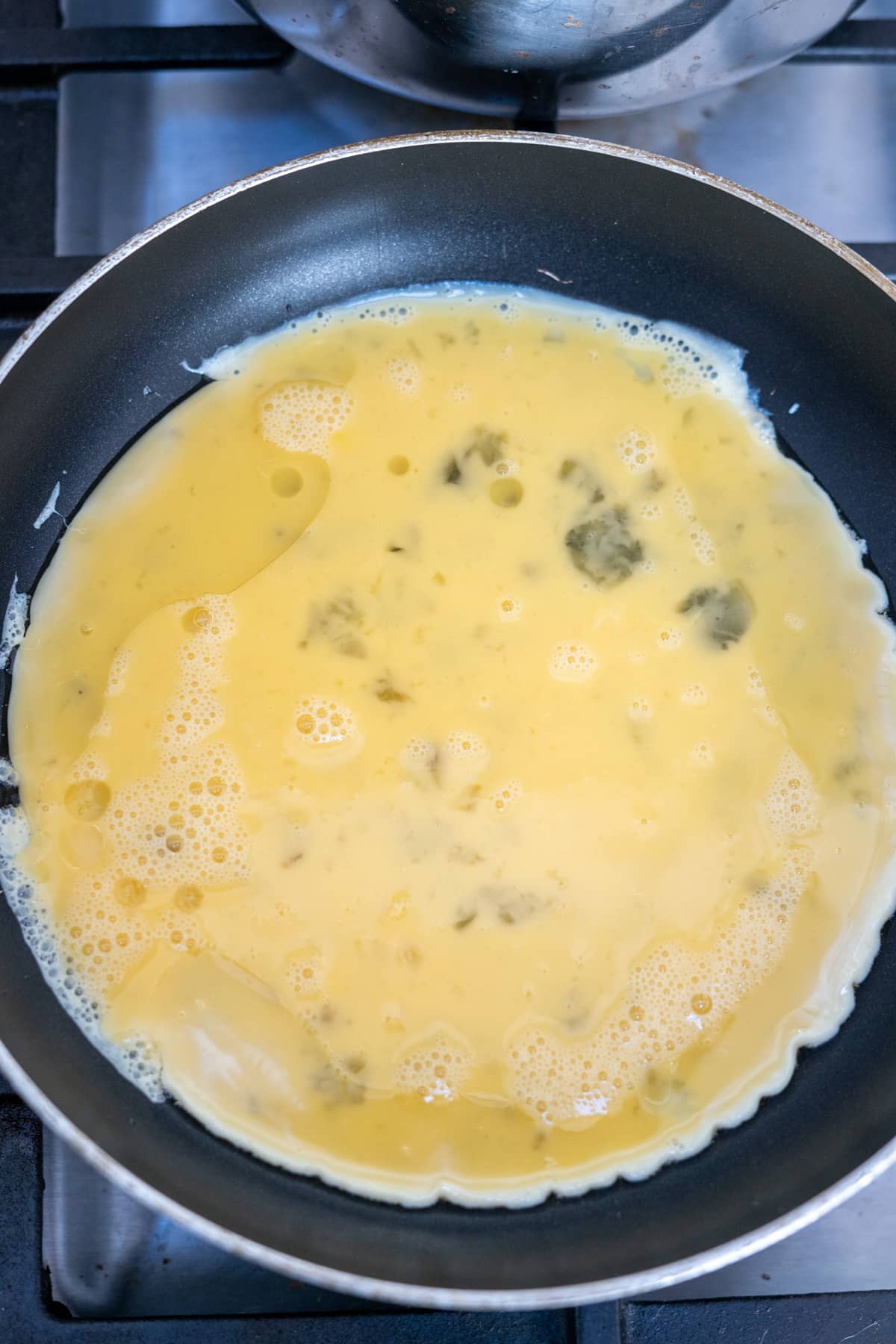 A frying pan with a chili omelette.