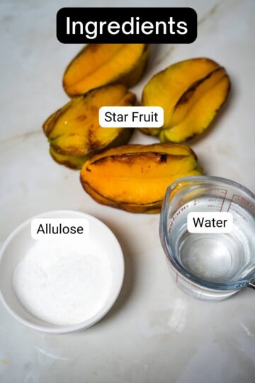 A bowl of allulose, star fruit, and water.