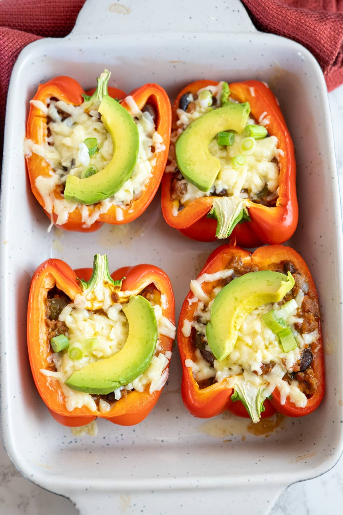 Mexican stuffed peppers in a baking dish.