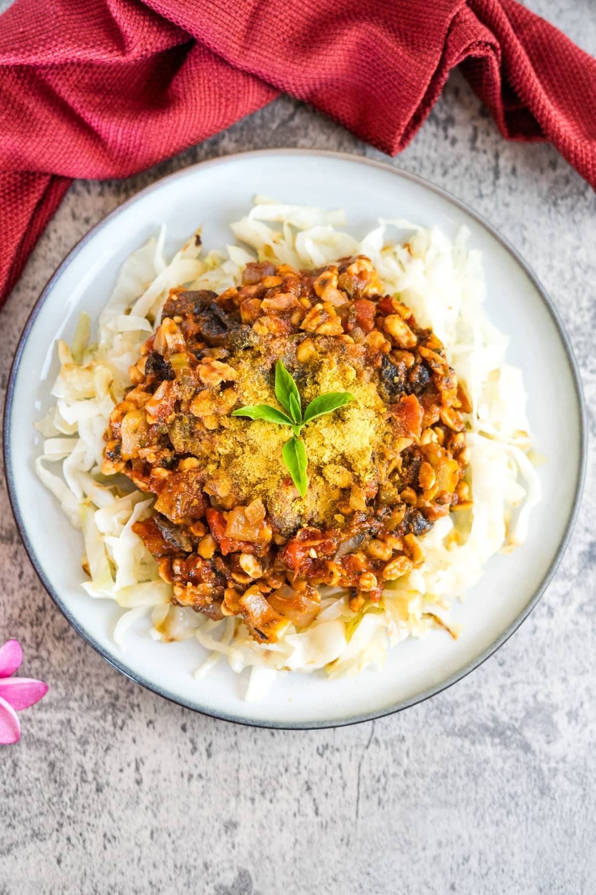 A plate of tempeh Bolognese with vegetables.