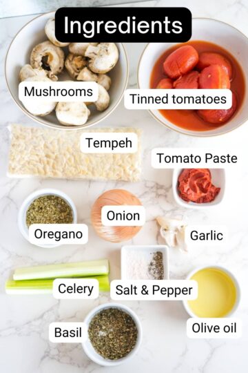 A list of ingredients for a tempeh bolognese pasta dish.