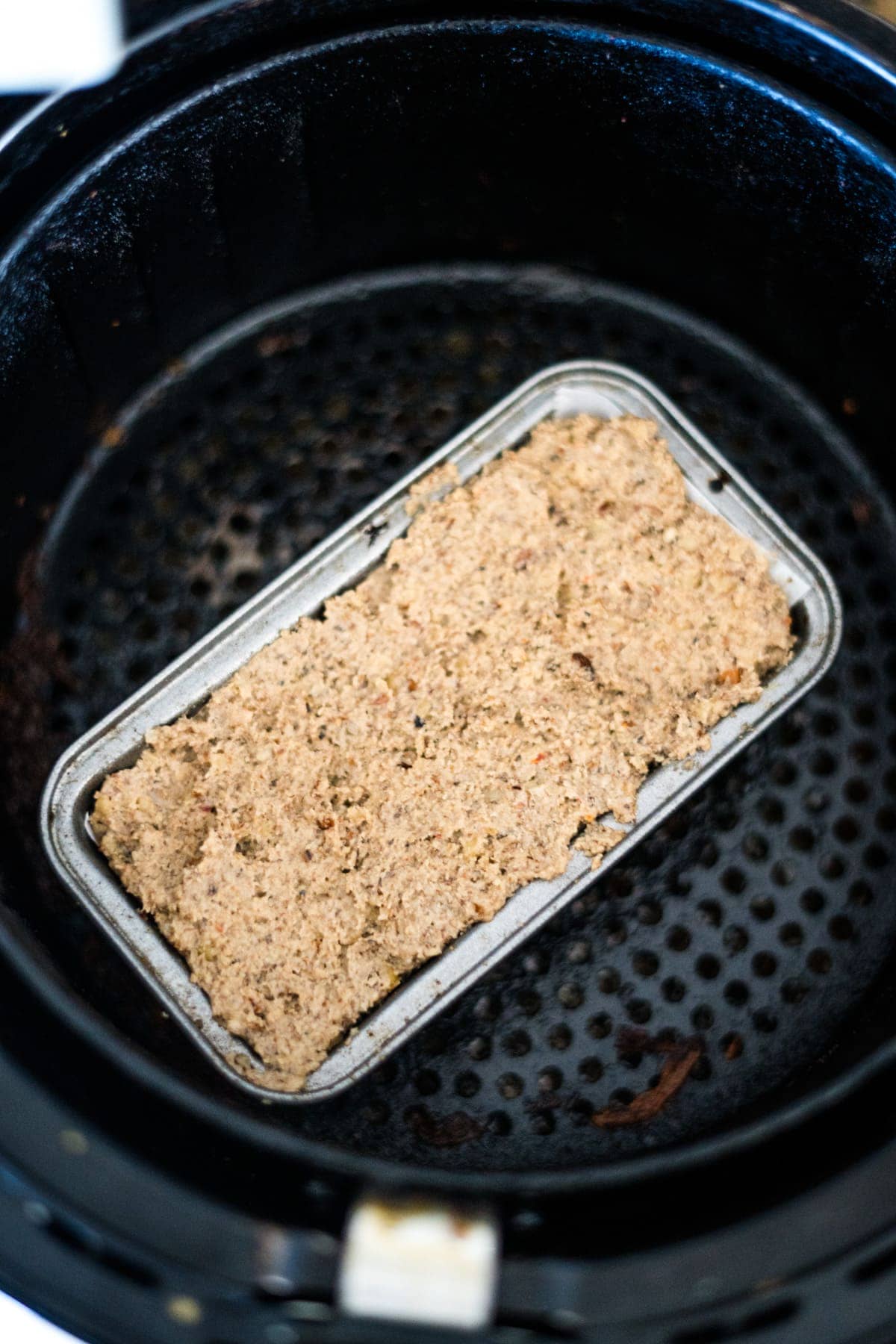 A nut roast in an air fryer.