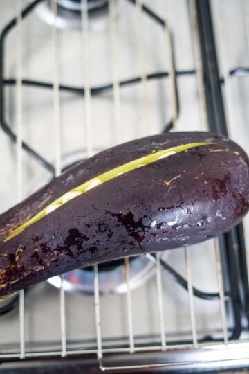 Baigan Choka with an eggplant sitting on top of a stove.